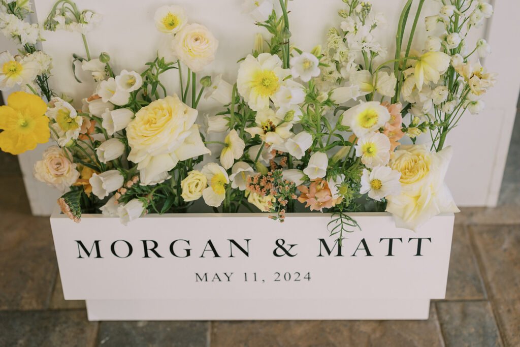 Spring floral arrangement in a welcome sign for a spring wedding located at a wedding venue near Atlanta, GA