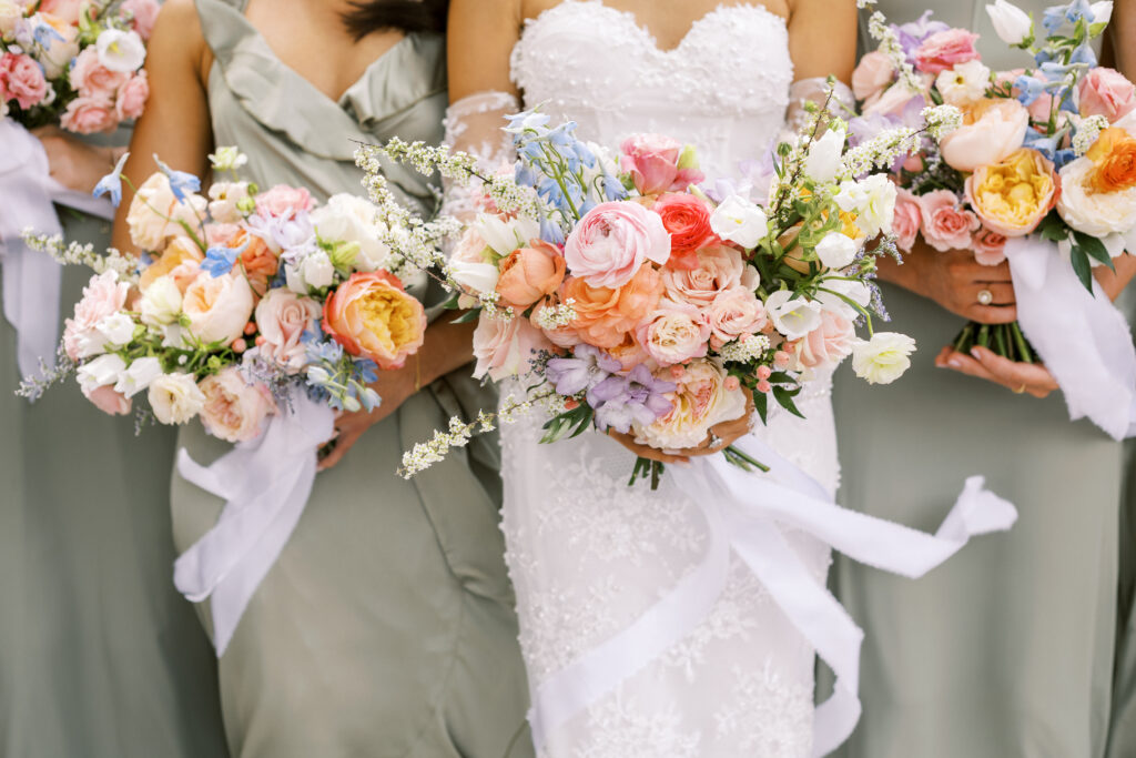 Colorful spring bridal bouquet and bridesmaids bouquets from a florist for an outdoor wedding ceremony at an Atlanta wedding venue 