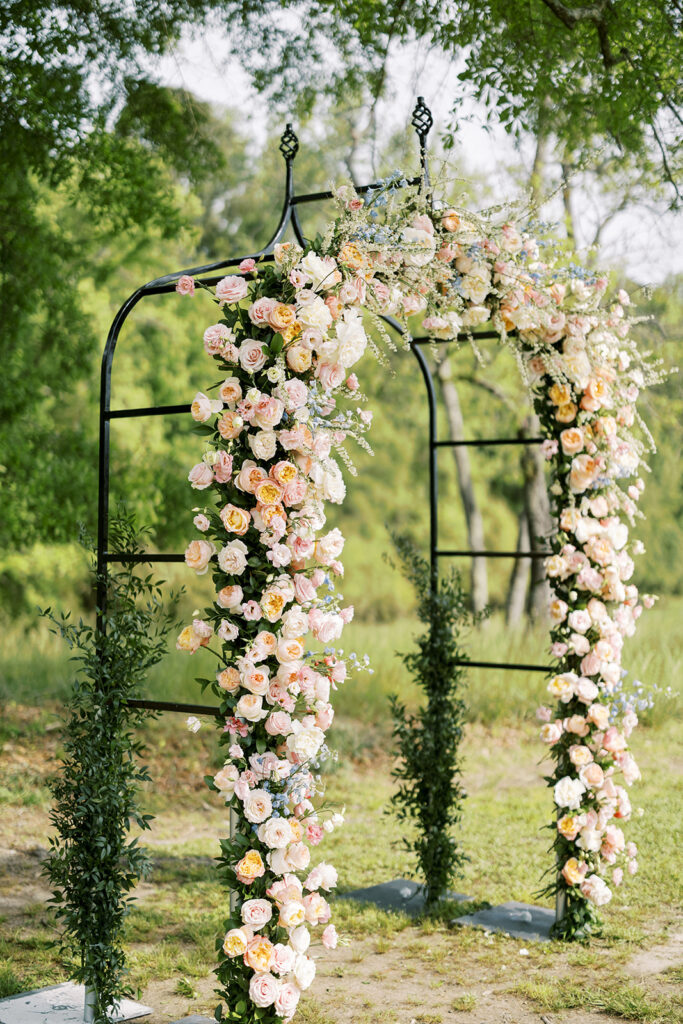 Grand floral arbor for an outdoor wedding venue located in Newnan, GA near Atlanta 